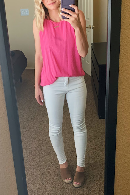 White jeans with a bright pink top
