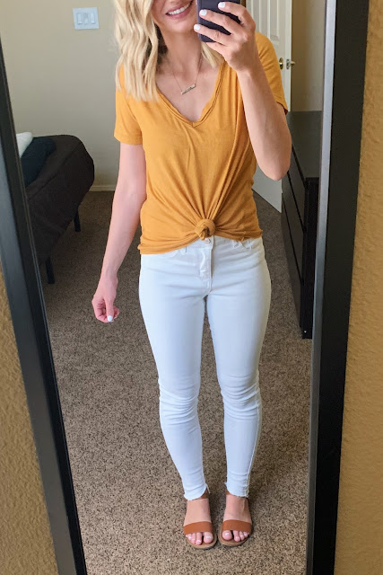 White jeans with a mustard yellow top