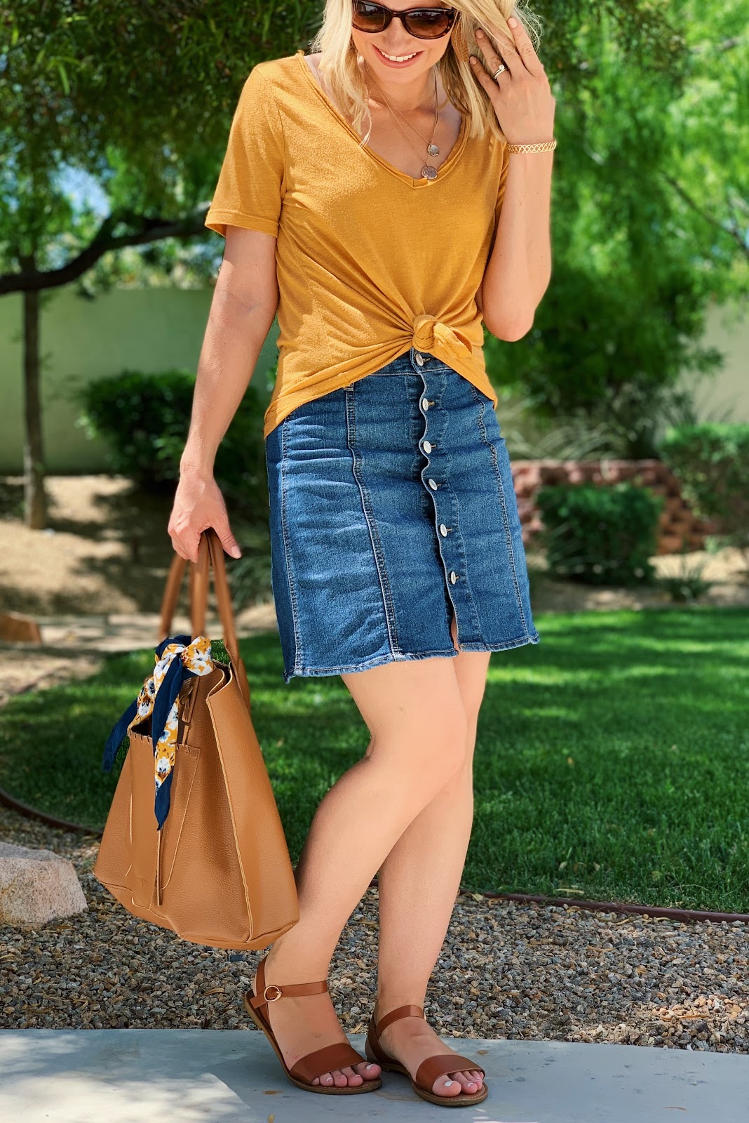 Yellow t-shirt with button front denim skirt