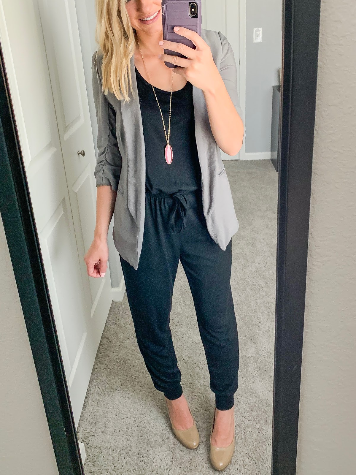 Black jumpsuit styled with a blazer