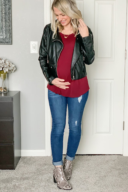 Date night outfit with a moto jacket and snakeskin booties