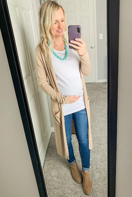 Neutral maternity outfit with a pop of turquoise