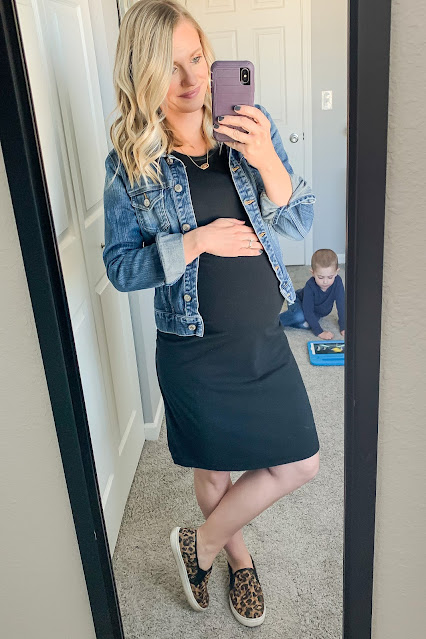 Fitted black maternity dress with denim jacket