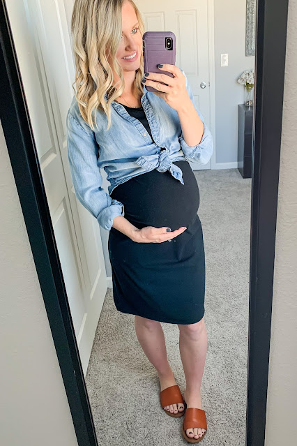 Fitted black maternity dress with chambray shirt