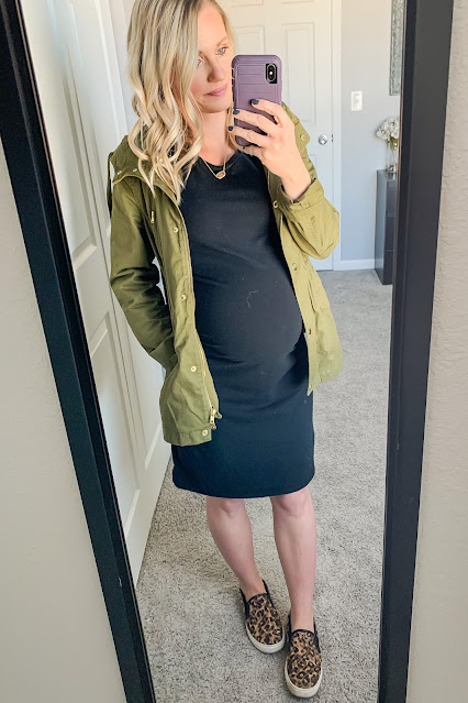 Fitted black maternity dress with utility jacket