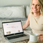 a blogger sitting on her bed with coffee