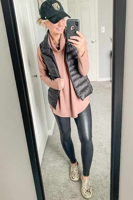 Faux leather leggings with a vest and turtleneck