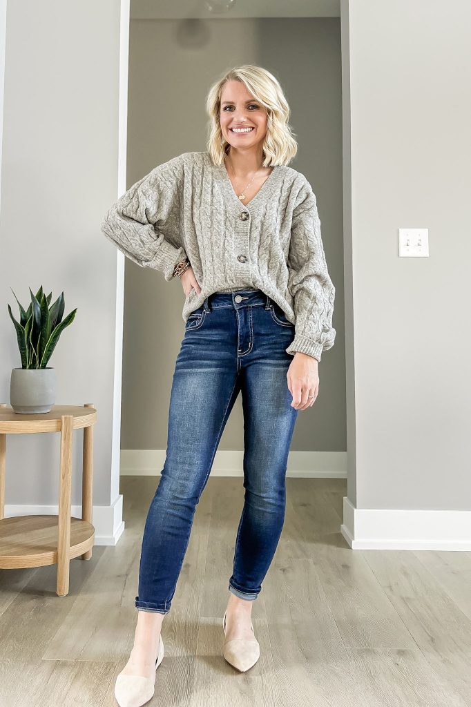 Grandpa sweater with skinny jeans and flats.