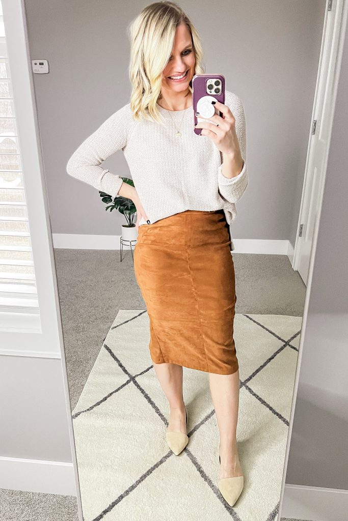 Suede skirt with tan sweater.