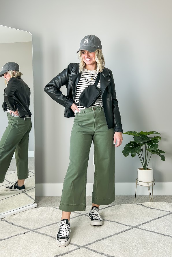 Moto jacket with olive green pants.