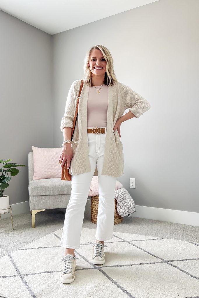 White cropped flare pants with a tan cardigan