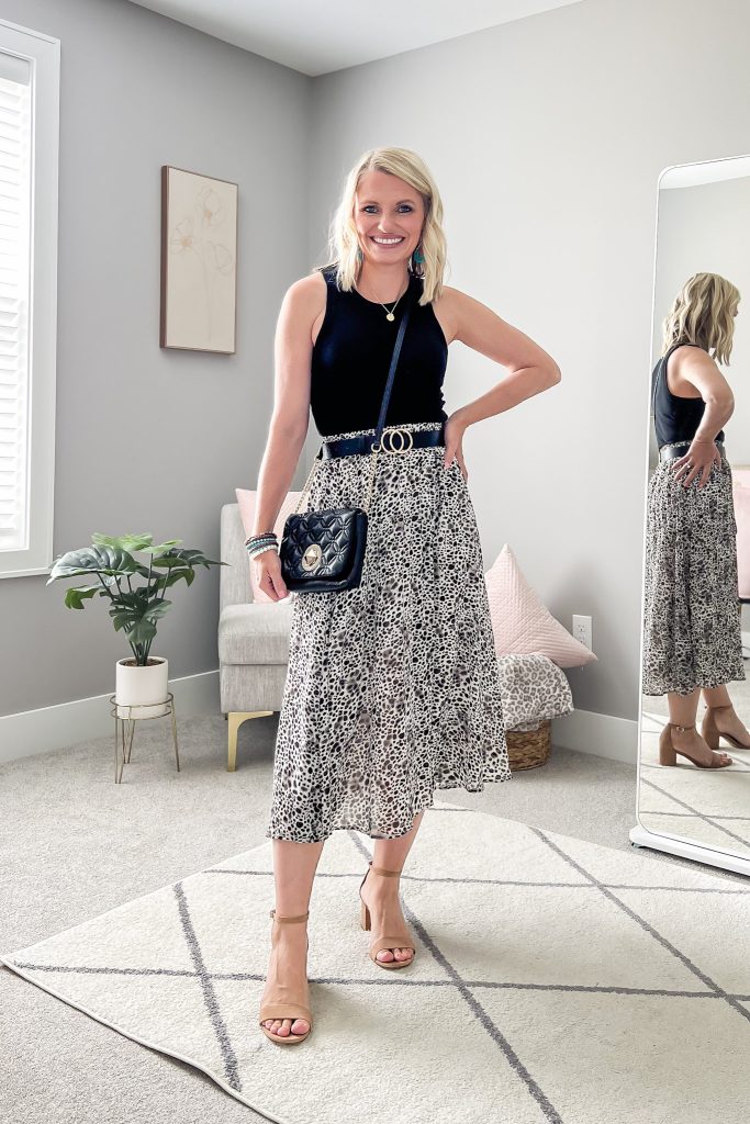 Leopard pleated skirt with a black tank top.