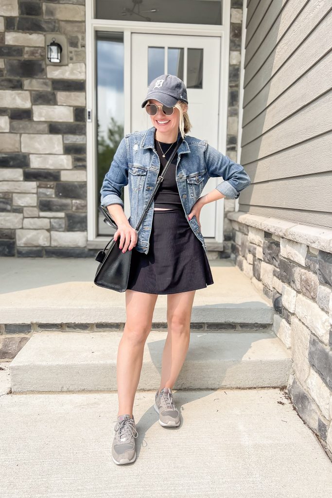 cute mom outfit with a black squort and athletic tank top.