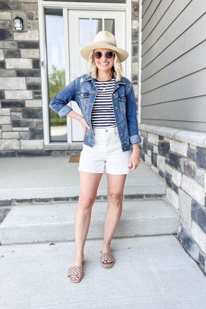 Cute mom outfit idea with white shorts and a navy and white striped shirt.