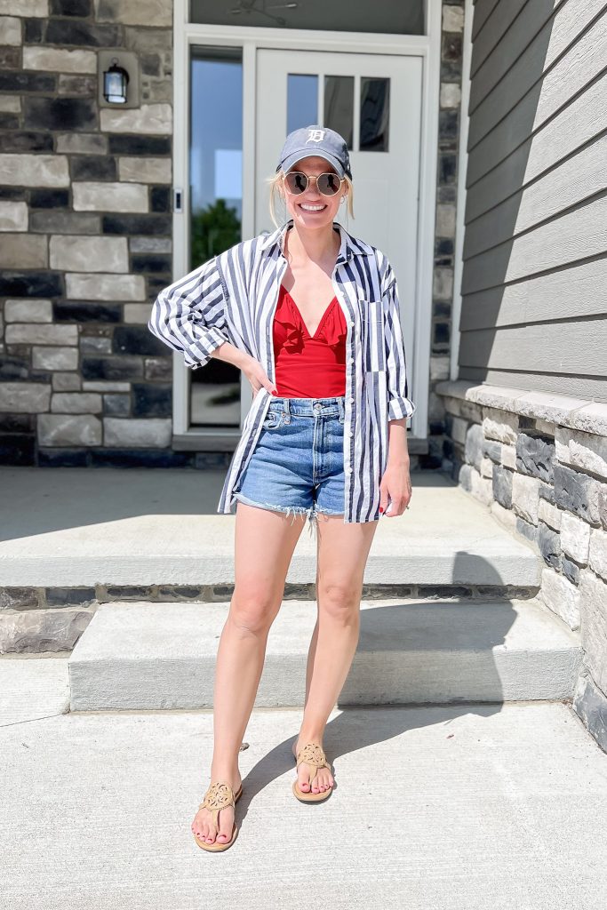 Cute mom outfit with a red bathing suit and denim short. 