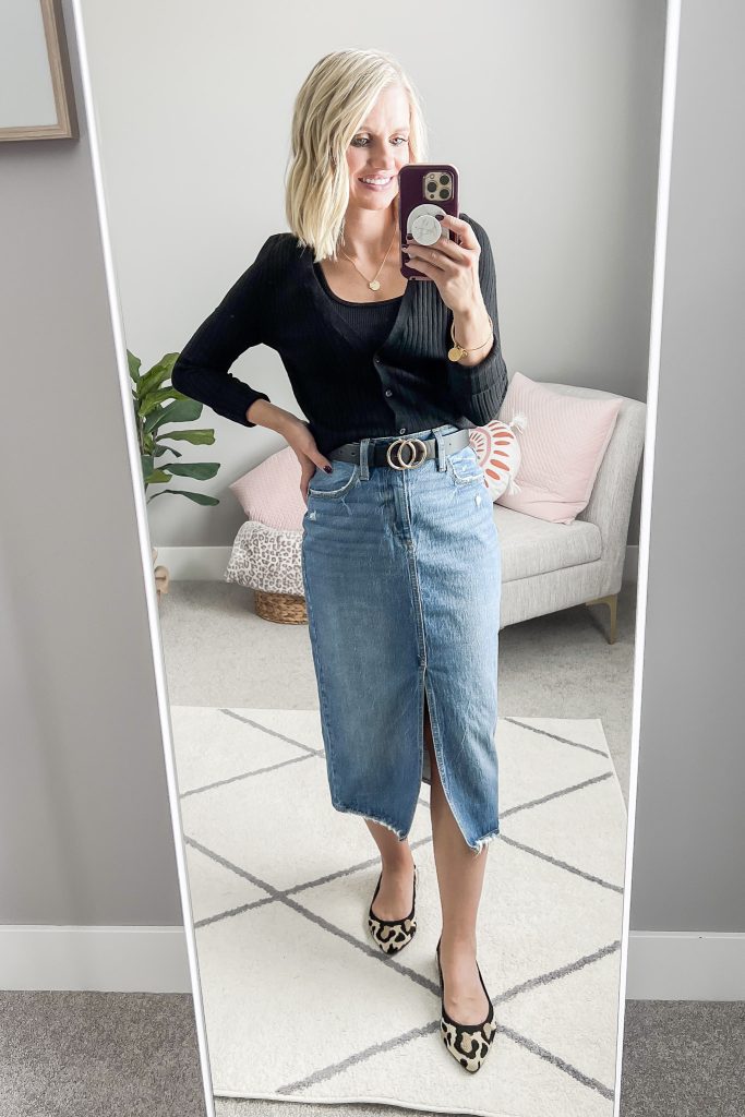 Black cardigan with a denim midi skirt and leopard flats.