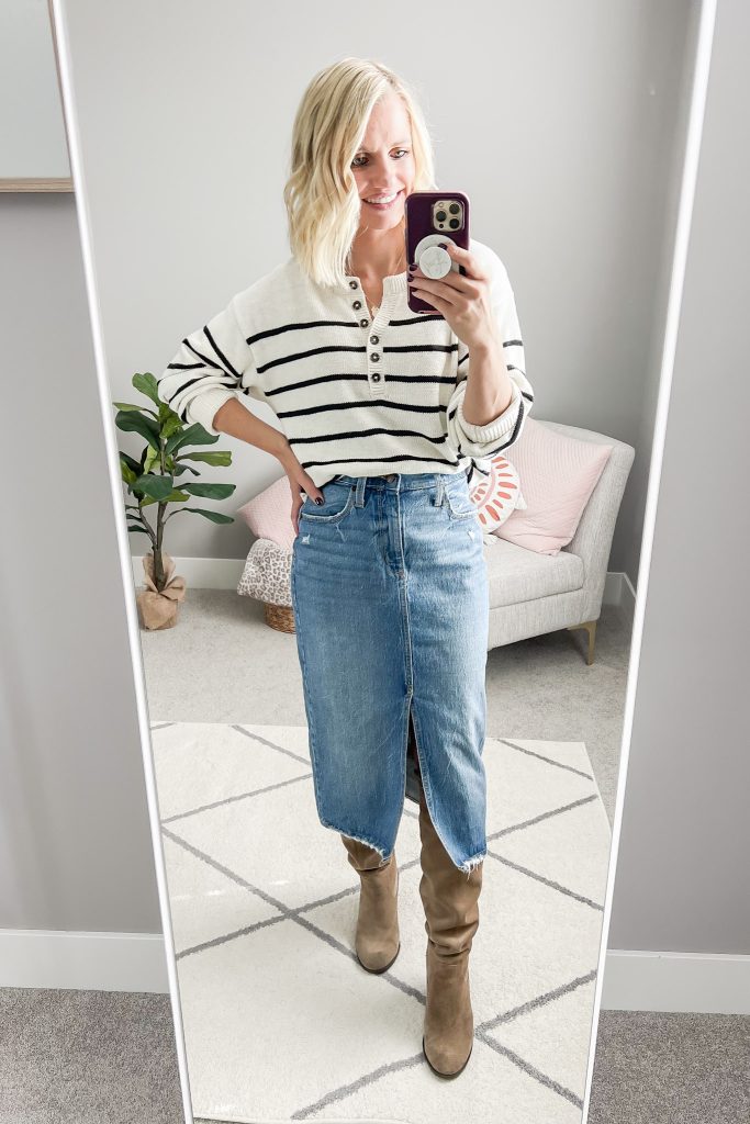 Striped sweater with a denim midi skirt and tall boots