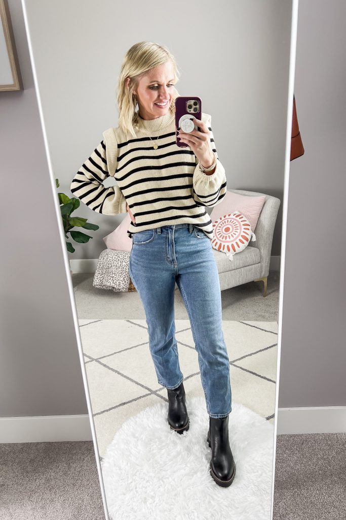 Straight-leg ankle length jeans styled with Chelsea boots.