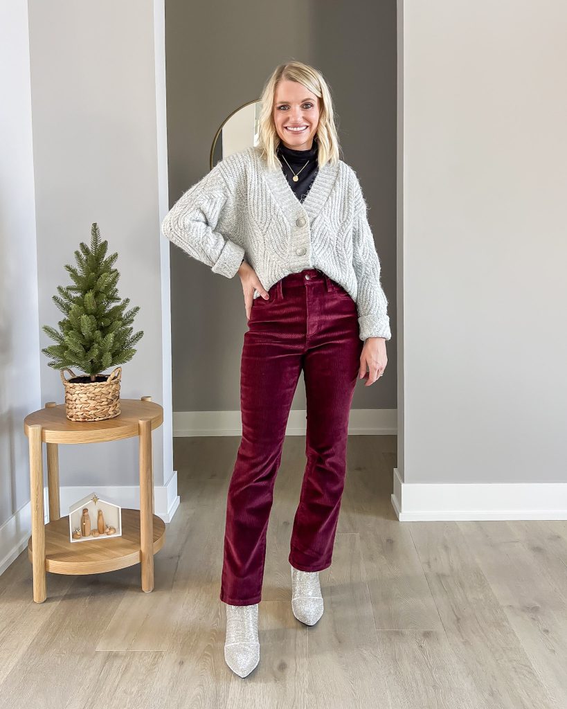 Corduroy flare pants with a gray sweater and rhinestone booties. 