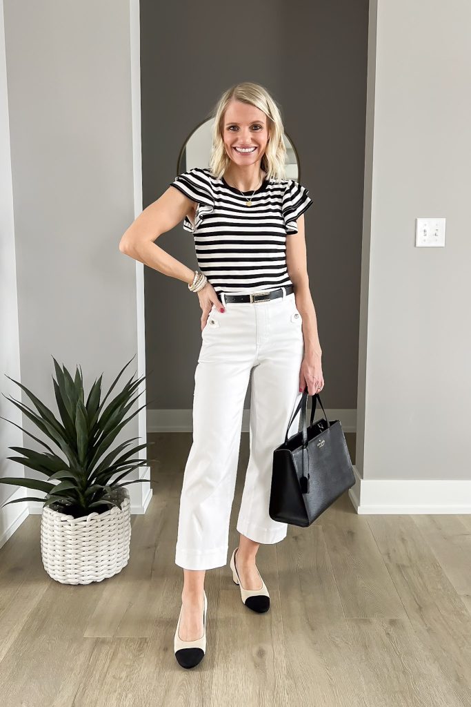 Striped flutter sleeve shirt with white wide-leg pants. 