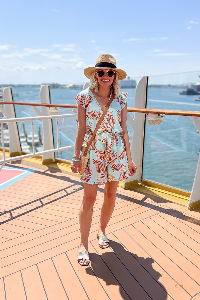 cruise outfit romper with leaf print and sun hat