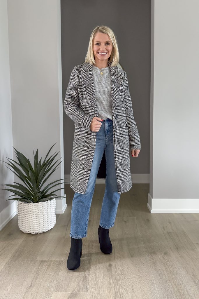 Gray sweater worn with a plaid coat and black booties. 