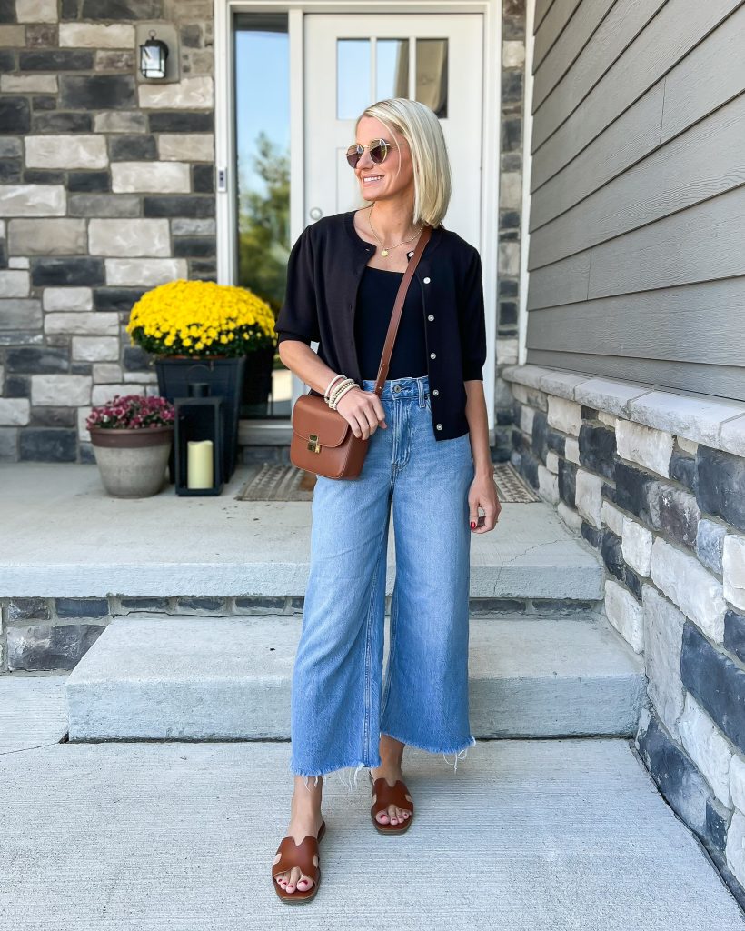 how to mix black and brown in an outfit with cropped denim, black cardigan and brown accessories