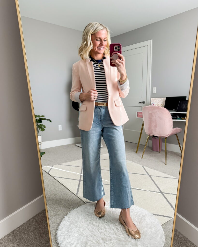 Jeans with a pink blazer and flats.