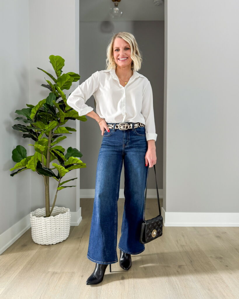 how to wear wide leg jeans with heels outfit idea with a button down blouse and black accessories