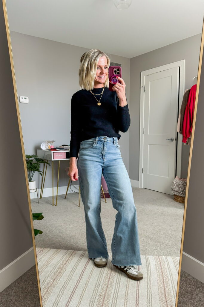 winter outfit idea wide leg jeans and black long sleeved sweater