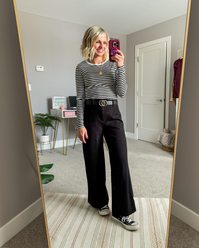 winter outfit idea wide leg black pants and striped long sleeved shirt