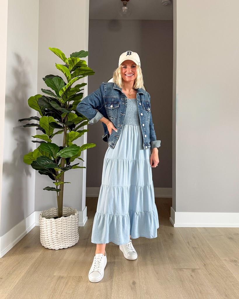 spring maxi dress with denim jacket, baseball cap and sneakers