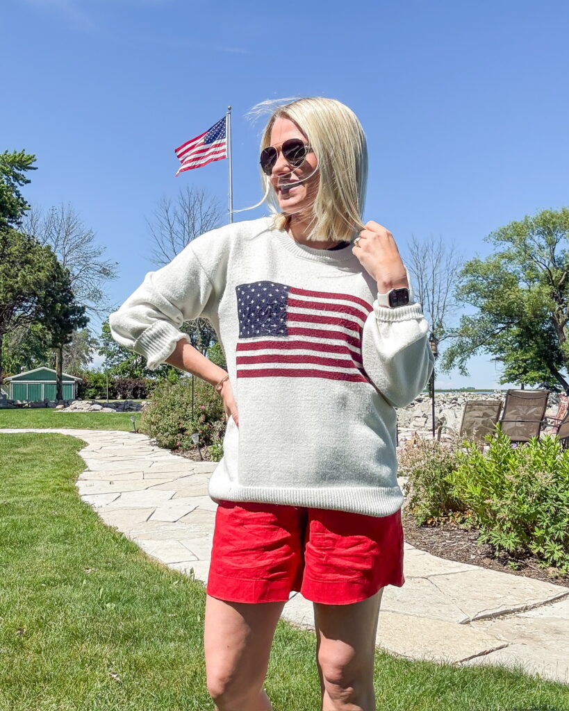 fourth of july outfit with red shorts and american flag sweater